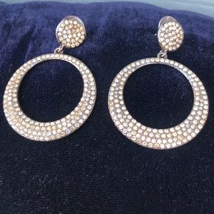 Express silver tone earrings with gold white gemstones
